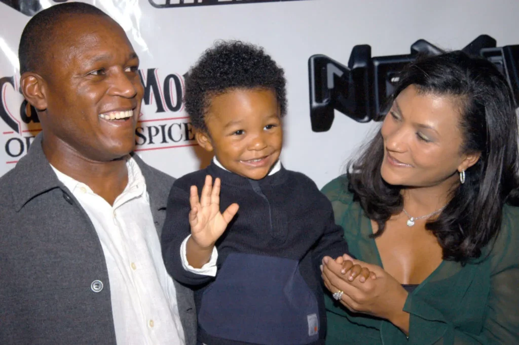 barry sanders with his two-year old son nigel and wife